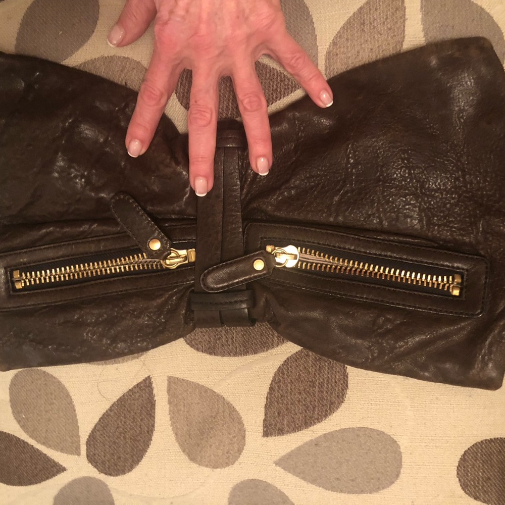 BCBG leather Maxazria bow clutch. High quality leathers & hardware.…
